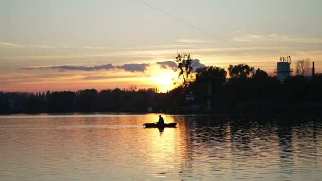 The river on which a boat sails at sunset