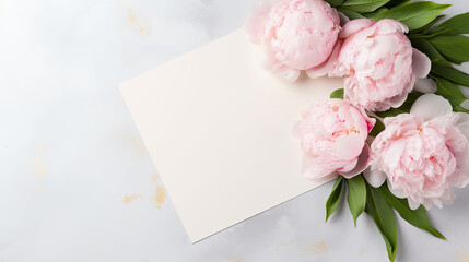 Greeting or invitation blank card  with peony flowers top view 
