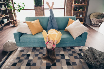 Photo of cheerful good mood cute girl with straight hairdo dressed yellow pullover lay on couch...