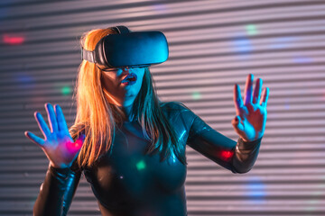 Amazed woman during an immersive game with Virtual reality goggles
