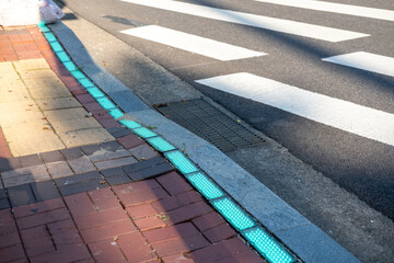 Street crossing in Seoul. The green light on the floor indicates that people can walk across. - obrazy, fototapety, plakaty