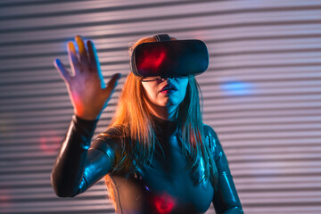 Surprised woman in an immersive game wearing Virtual reality goggles