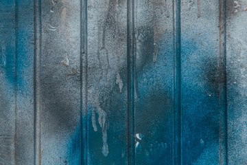 Blue paint spot stain old dirty fence surface weathered texture background