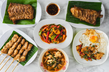 Many types of delicious food made from crocodile meat. Grilled crocodile steak with Thai spicy dipping sauce or Jaew sauce,Hot spicy crocodiles soup,Spicy stir fried crocodile,Grilled crocodile steak.