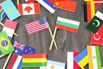 The concept is diplomacy. In the middle among the various flags are two flags - USA, Bulgaria