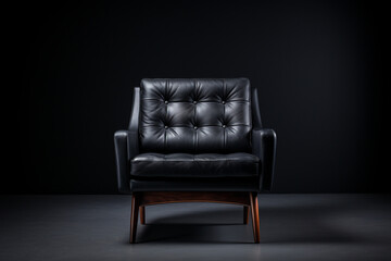 Black modern chair on black background.