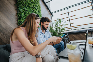 Successful Couple Discussing New Business Ideas in an Urban Coffee Bar