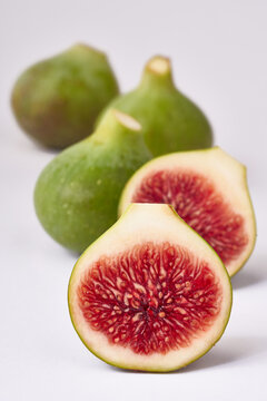 Fresh green figs on white background