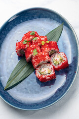 Japanese cuisine. Delicious Rolls with salmon and caviar

