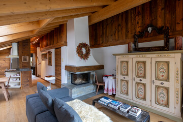 Cozy mountain chalet living room interior with wood accents