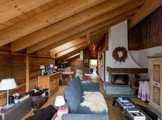 Cozy wooden interior of a spacious chalet living room