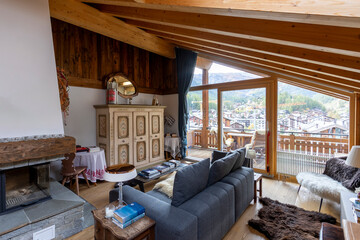 Cozy mountain chalet living room with panoramic view