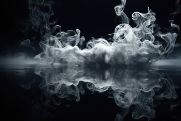 A captivating black and white photo capturing the mesmerizing sight of smoke rising out of the...