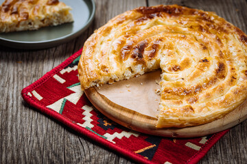 Traditional Bosnian and Turkish meal made from rolled pastry filled with spinach. In Turkey it is called Borek with cheese. In Bosnia this dish is called Pita Sirnica. Made from phyllo pastry.