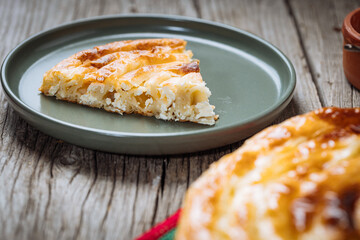 Traditional Bosnian and Turkish meal made from rolled pastry filled with spinach. In Turkey it is called Borek with cheese. In Bosnia this dish is called Pita Sirnica. Made from phyllo pastry.