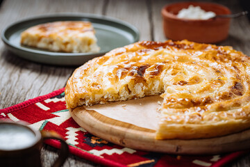 Traditional Bosnian and Turkish meal made from rolled pastry filled with spinach. In Turkey it is called Borek with cheese. In Bosnia this dish is called Pita Sirnica. Made from phyllo pastry.