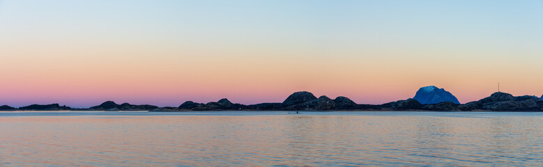 Naklejka na ściany i meble November light and calm sea at the Helgeland Coast.