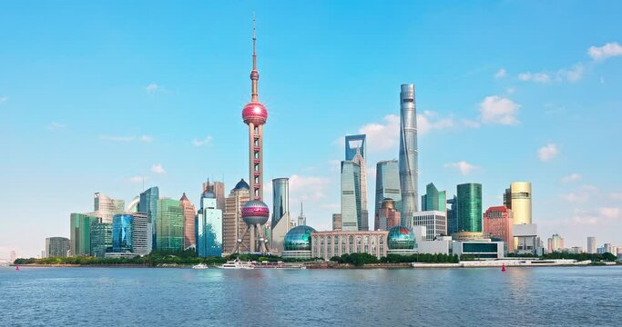 Fixed camera video of Shanghai city skyline and river on a sunny summer day