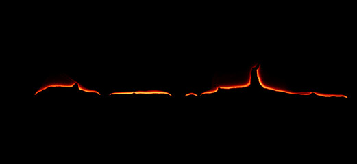 burning paper, glowing edge of paper on a black background