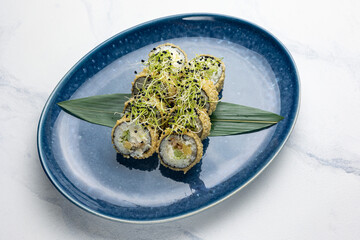 Japanese cuisine. Delicious fried rolls with salmon
