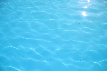 Beautiful  in swimming pool. Beautiful blue rippled wave water in swimming pool with sunny...