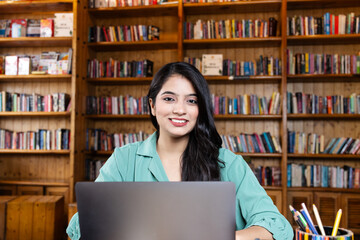 Beautiful young business woman girl student studying or explaining on video call on laptop in...