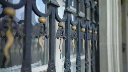 Protective metal window gate with decorative adornment. Aesthetic barrier against intruders with...