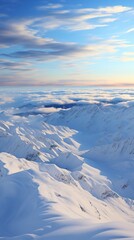 Fototapeta premium A snow covered mountain range with sunlight glinting off ,Winter Landscape,Panaromic Image