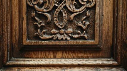 Timeless Craftsmanship - Engraved Adornments on Antique Wooden Door of Traditional Building