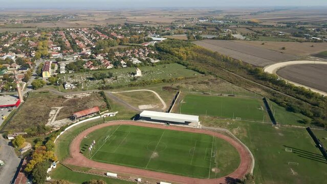 Sport courts, cemetery and residential area of Sombor, Serbia viewed from drone point of view