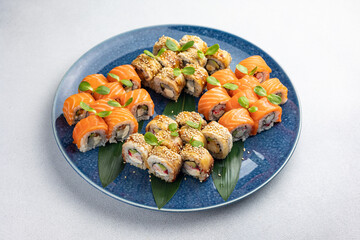 Japanese cuisine. Delicious fried rolls with salmon