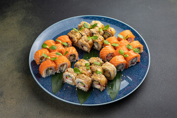 Japanese cuisine. Delicious fried rolls with salmon