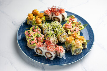 Japanese cuisine. Delicious fried rolls with salmon