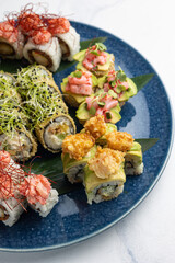 Japanese cuisine. Delicious fried rolls with salmon