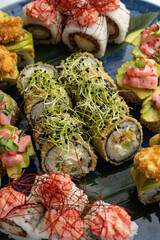 Japanese cuisine. Delicious fried rolls with salmon