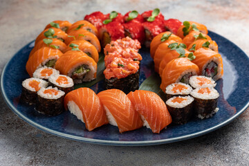Japanese cuisine. Delicious fried rolls with salmon