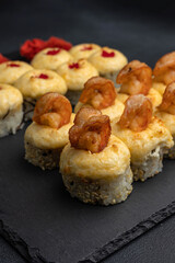 Japanese cuisine. Delicious fried rolls with salmon