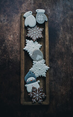 Christmas gingerbread on a wooden background with pine