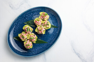 Japanese cuisine. Sushi hand rolls with tuna and avocado