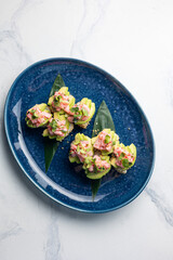 Japanese cuisine. Sushi hand rolls with tuna and avocado