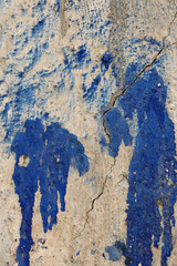 blue paint on a concrete wall