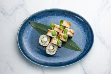 Japanese cuisine. Handmade sushi rolls with eel