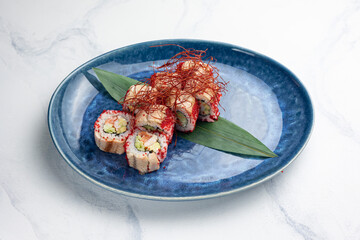 Japanese cuisine. Sushi hand rolls with eel and salmon