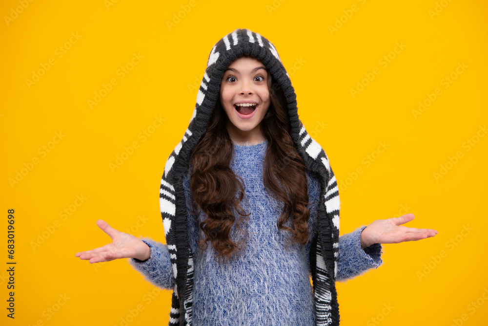 Sticker amazed teenager. beautiful winter kids portrait. teenager girl posing with winter sweater and knit h