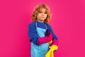 Children helping with housekeeping, cleaning the house. Housekeeping at home. Cute child boy...