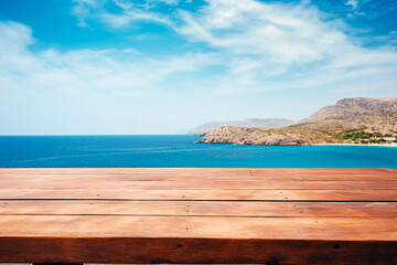 Fototapeta premium A wooden table set against the backdrop of the sea, an island, and the blue sky.Empty space for text. Bright image.