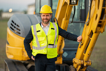 Construction owner near excavator. Confident construction owner in front of house. Architect, civil...