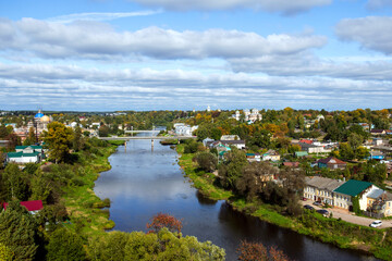 Fototapeta na wymiar Torzhok, Russia - small village with winding river and small cottages, lush of greenery. Top view.