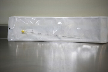 Yellow long spinal needle used to enter the disc and treat herniated disc - obrazy, fototapety, plakaty