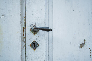 Old door handle with patina